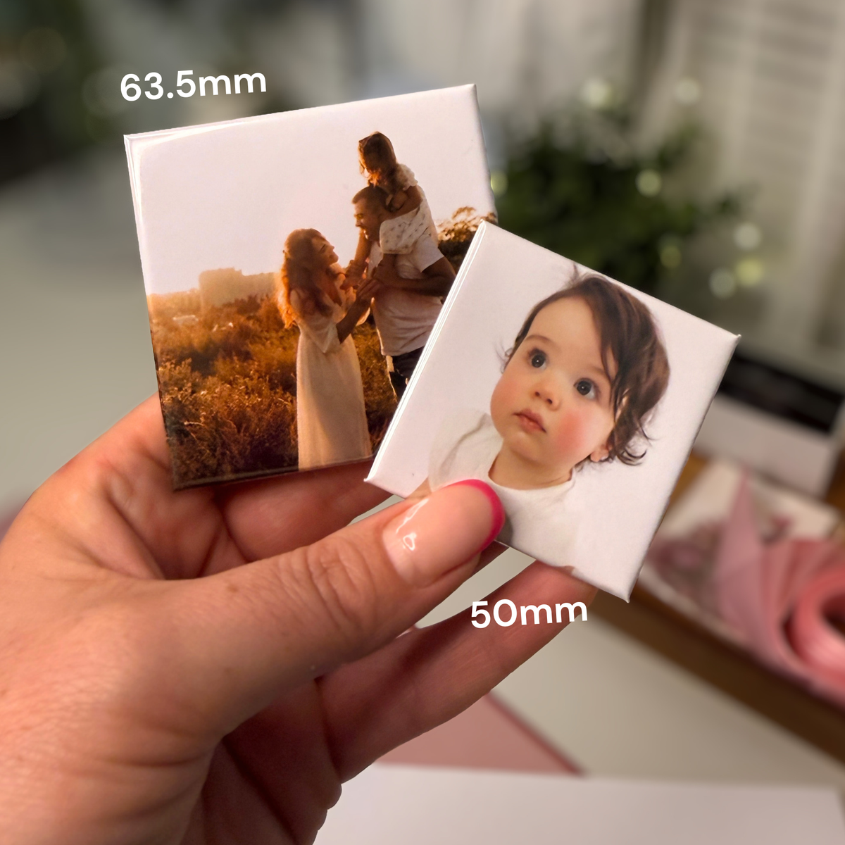 50mm and 63.5mm custom photo magnets held in hand — handmade in Melbourne