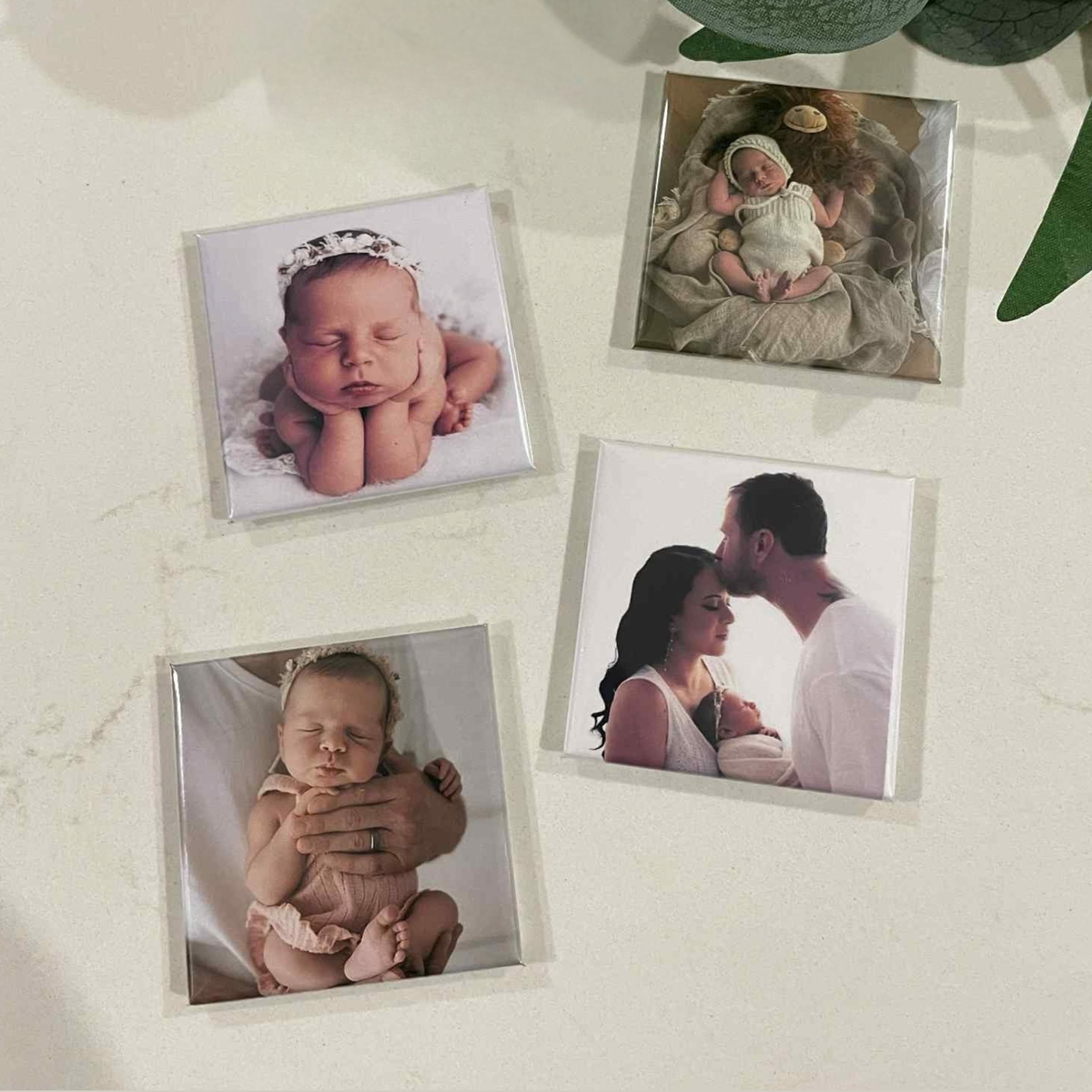 Four custom square photo magnets with newborn and family photos — personalised set of 4 fridge magnets handmade in Melbourne
