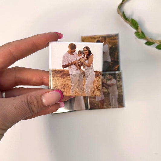 Hand holding a custom 50mm photo magnet with a family photo — personalised photo magnets handmade in Melbourne